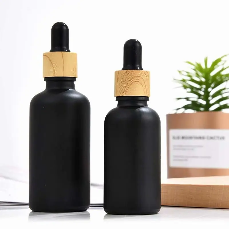 Glass oil dropper and spray mat black frosted amber glass bottle with bamboo spray pump 30 ml dropper cosmetic