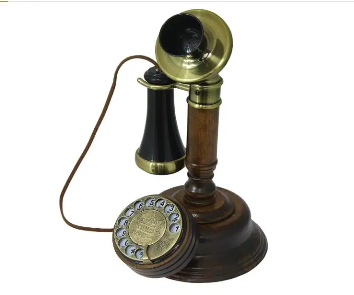 The Old-Fashioned Wall-Mounted Wooden Retro Telephone with Metal Parts with Vintage Rotary Dial and Metal Bell