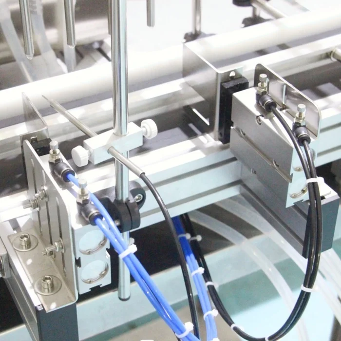 Automatic Desktop Cnc Peristaltic Pump Liquid Oil Filling Machine With Conveyor For Perfume Filling Machine Water Filler