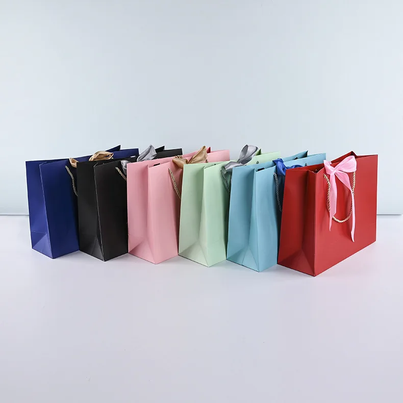 Luxury premium shopping paper bag with your own logo printed packaging de small paper gift bags with ribbon