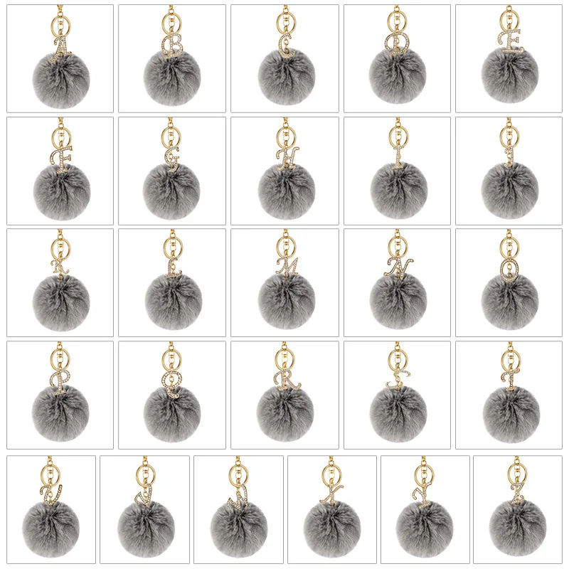 8cm popular new designs 26 English letters Keychain Faux Fur Pompon Keychain Women Rhinestone Leather faux Rabbit fur Ball