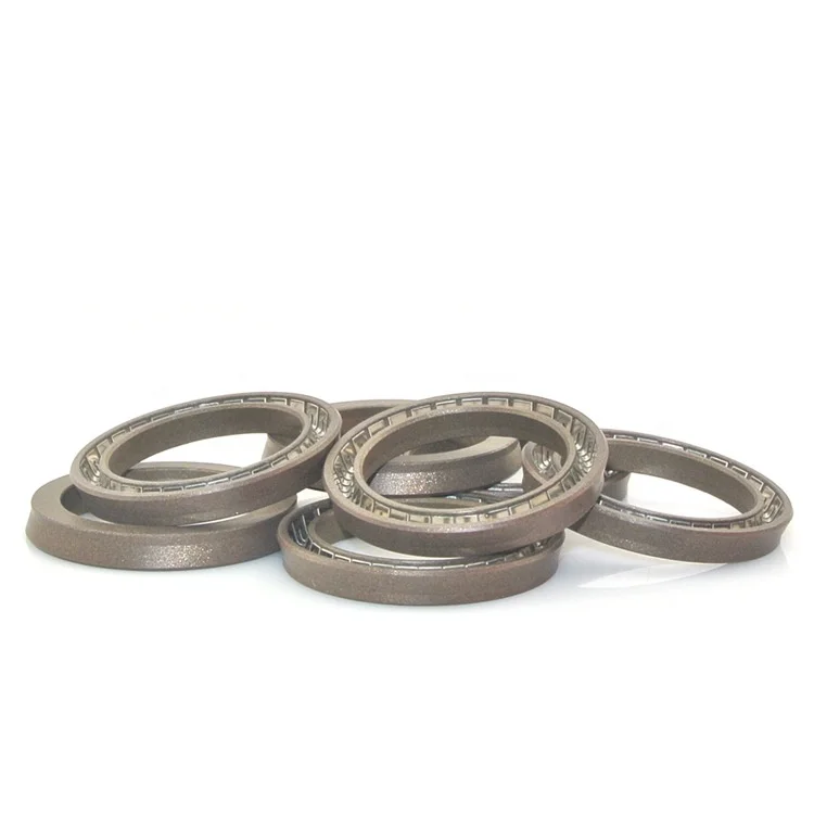 Corrosion resistant V-spring rotary shaft filled plug seals for hydraulic machinery and equipment
