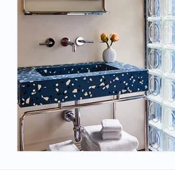 Steel and hampered copper apron bathroom vanity bases Carrara marble counter top  black round tubing washstand floating sink leg