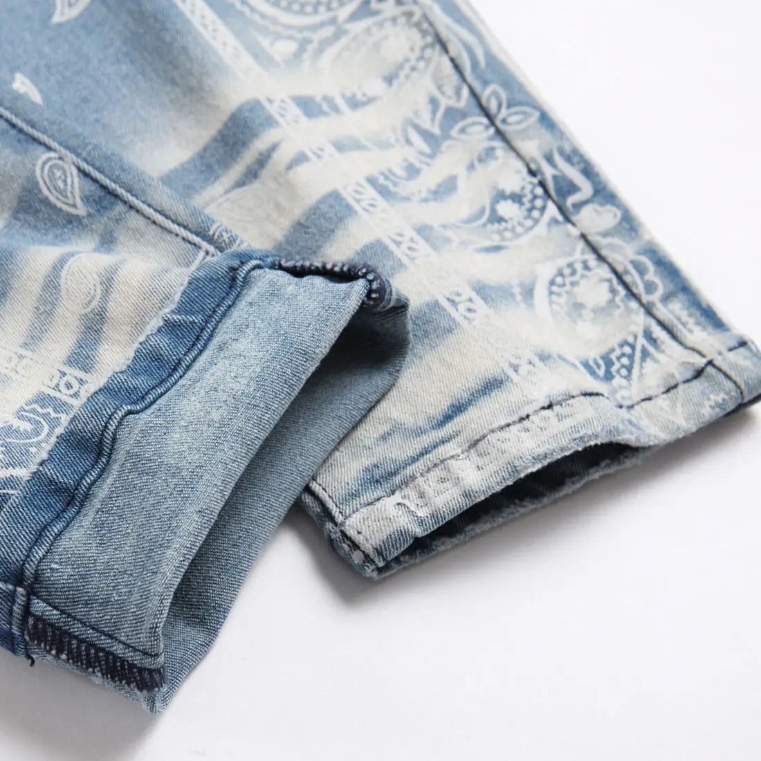 AeeDenim OEM ODM Logo AM light blue elastic slim small straight knee hole cashew flower digital printing denim jeans