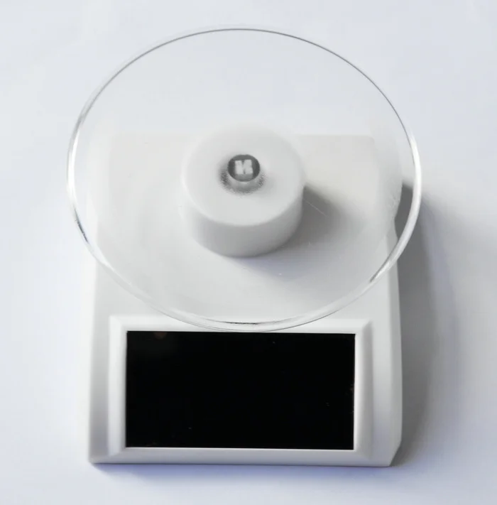 Free Technic Support solar watch display shelf solar acrylic display/lipstick display/round rotating solar power tools solar toy