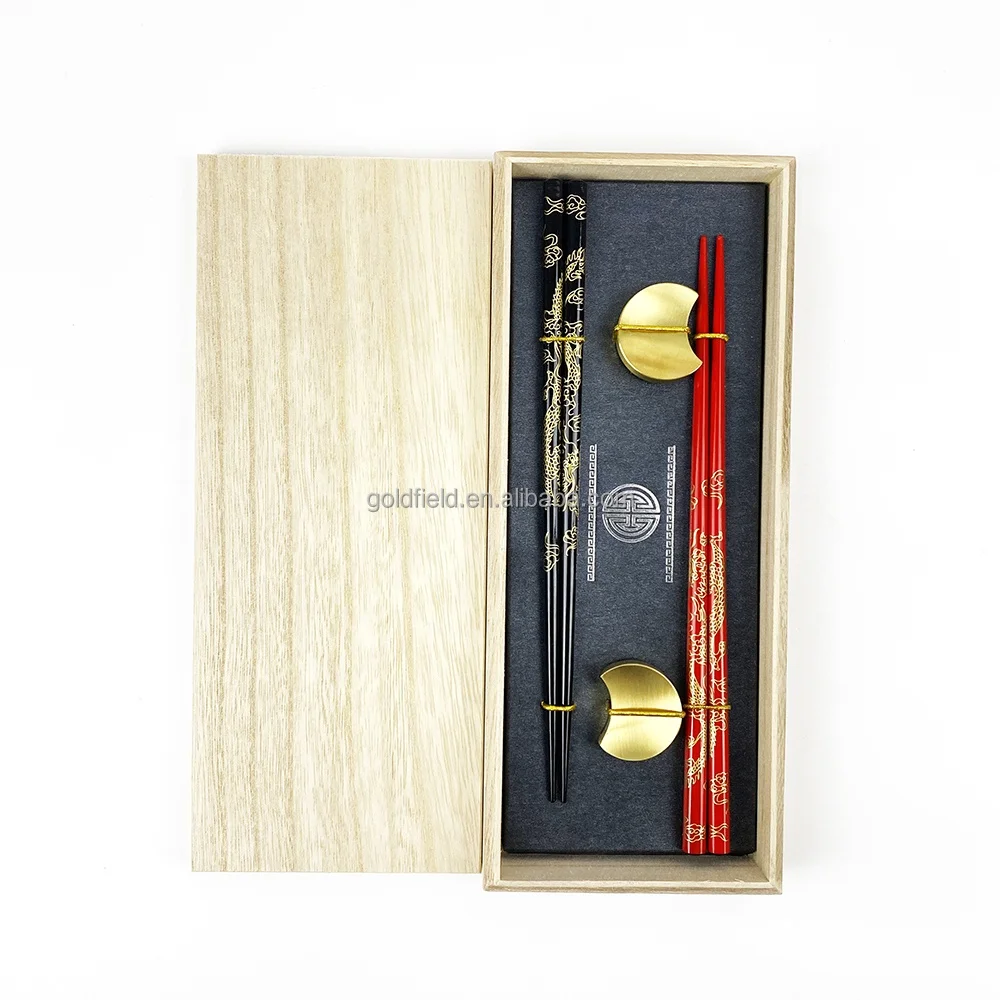 high-end golden dragon wood chopsticks with elegant golden moon stainless steel holders for restaurant