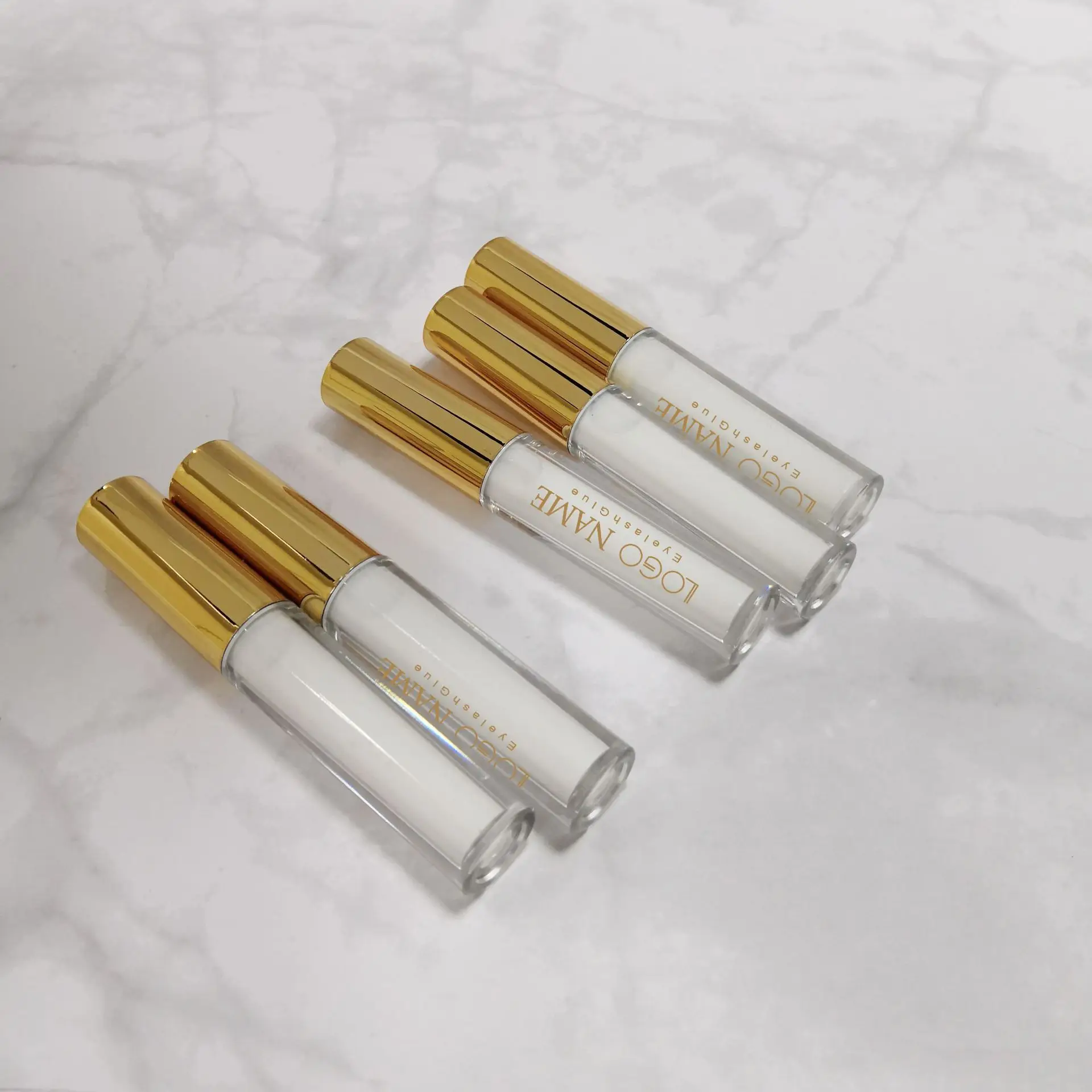 Custom Rose Golden bottle strip eyelash glue waterproof lash glue wholesale private label fast drying lash glue