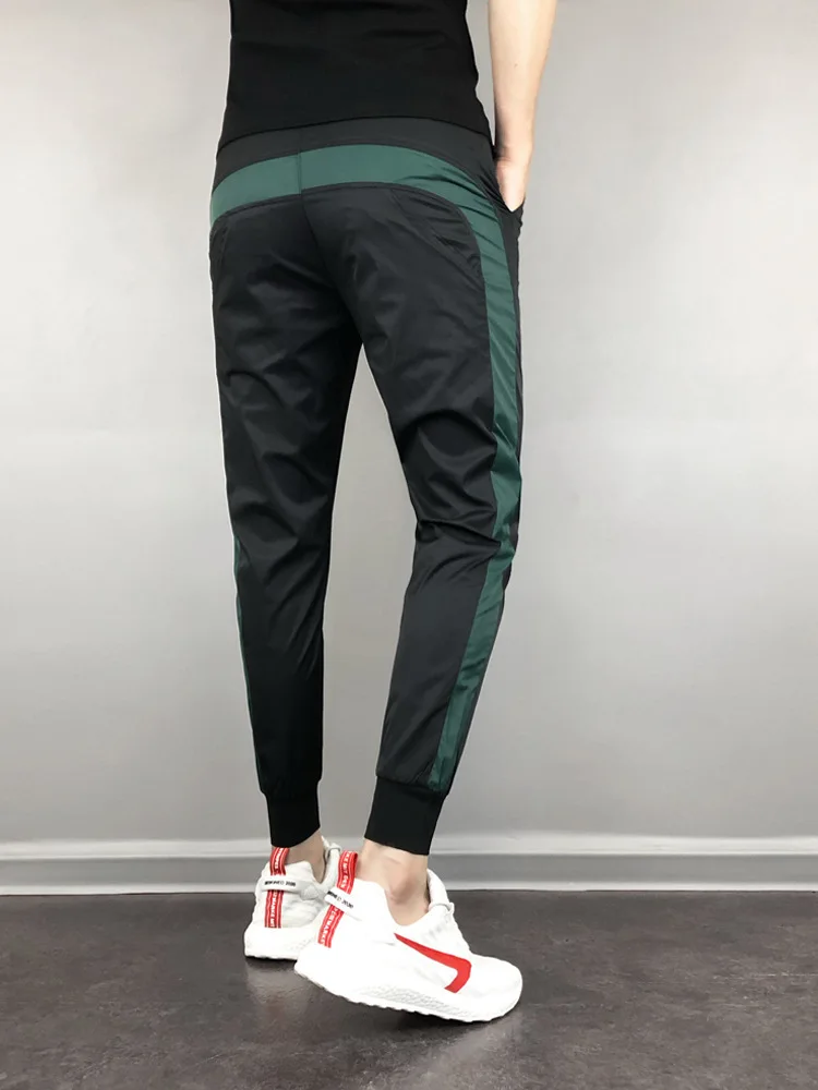 FanLi Men Loose Fit Reflective Printing Drawstring Windbreaker Mesh Lined Sport Track Pants