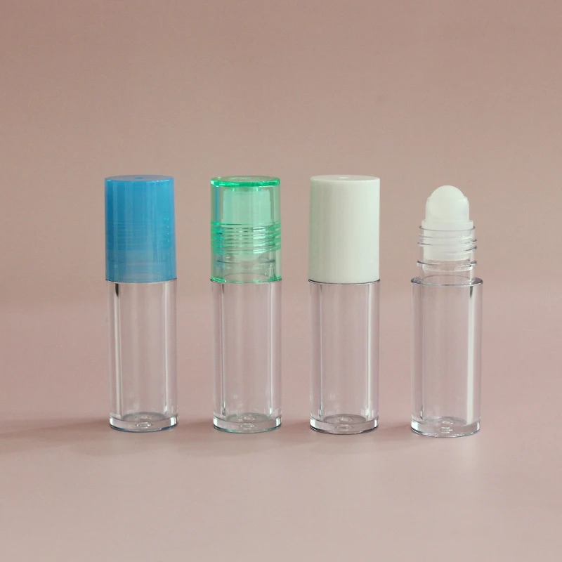 Low moq high quality round clear pink top thick wall lip oil tube  container cosmetic lip gloss packaging roll on lip gloss