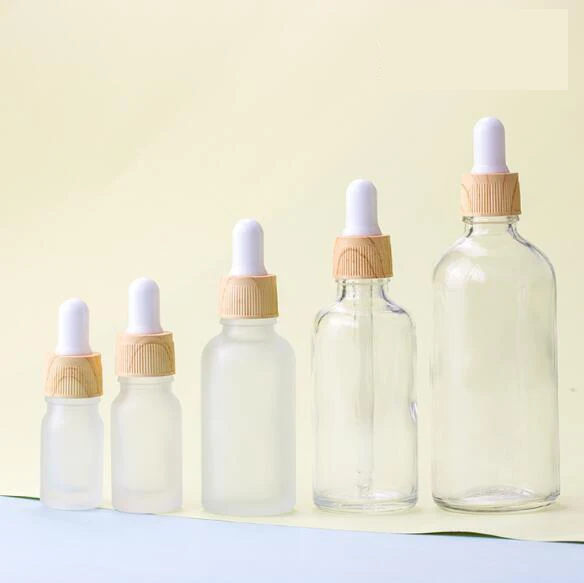 
cosmetic glass essential oil bottles 5 10 15 20 ml 30ml 50 100 ml frosted glass bottle water transfer wood grain dropper 