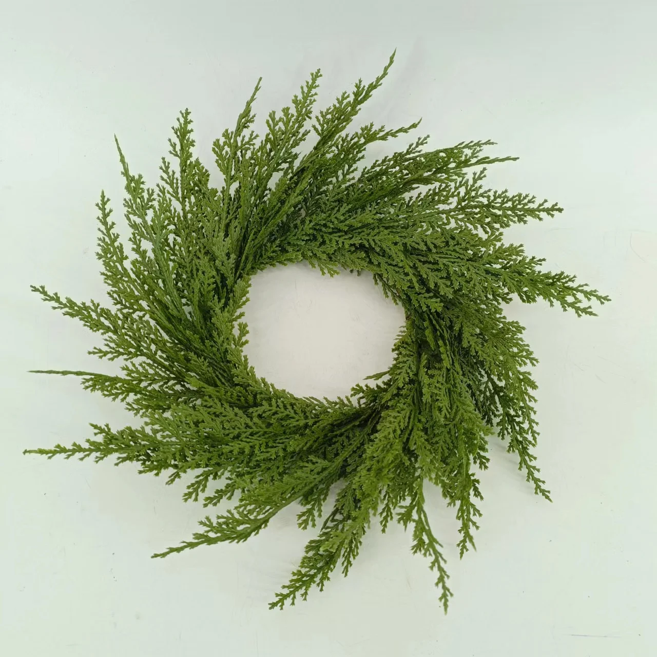 Wholesale artificial plants cypress leaf wreaths and candle rings for Christmas decorations