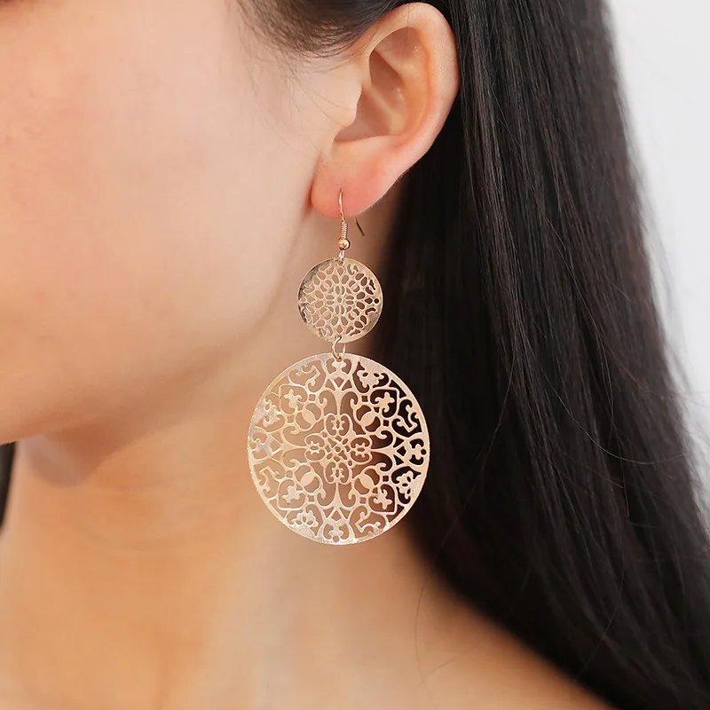 Hot sale European and American fashion earrings retro hollow disc frosted earrings ethnic style carved stud earrings