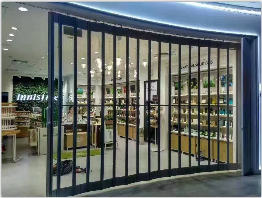 custom High-end brand cosmetics store door beautiful transparent pvc crystal aluminum alloy reinforced material folding door