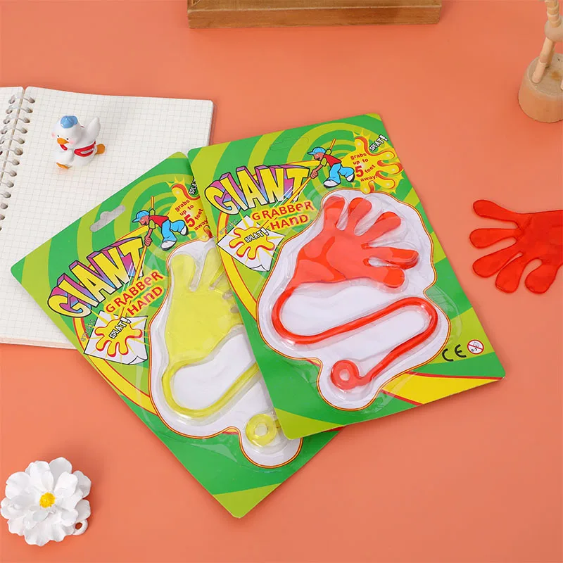 Wholesale Novelty Kids Suction Card Packaging Big Stretch TPR Soft Rubber Elastic Hand Shape Sticky Wall Toys For Sale