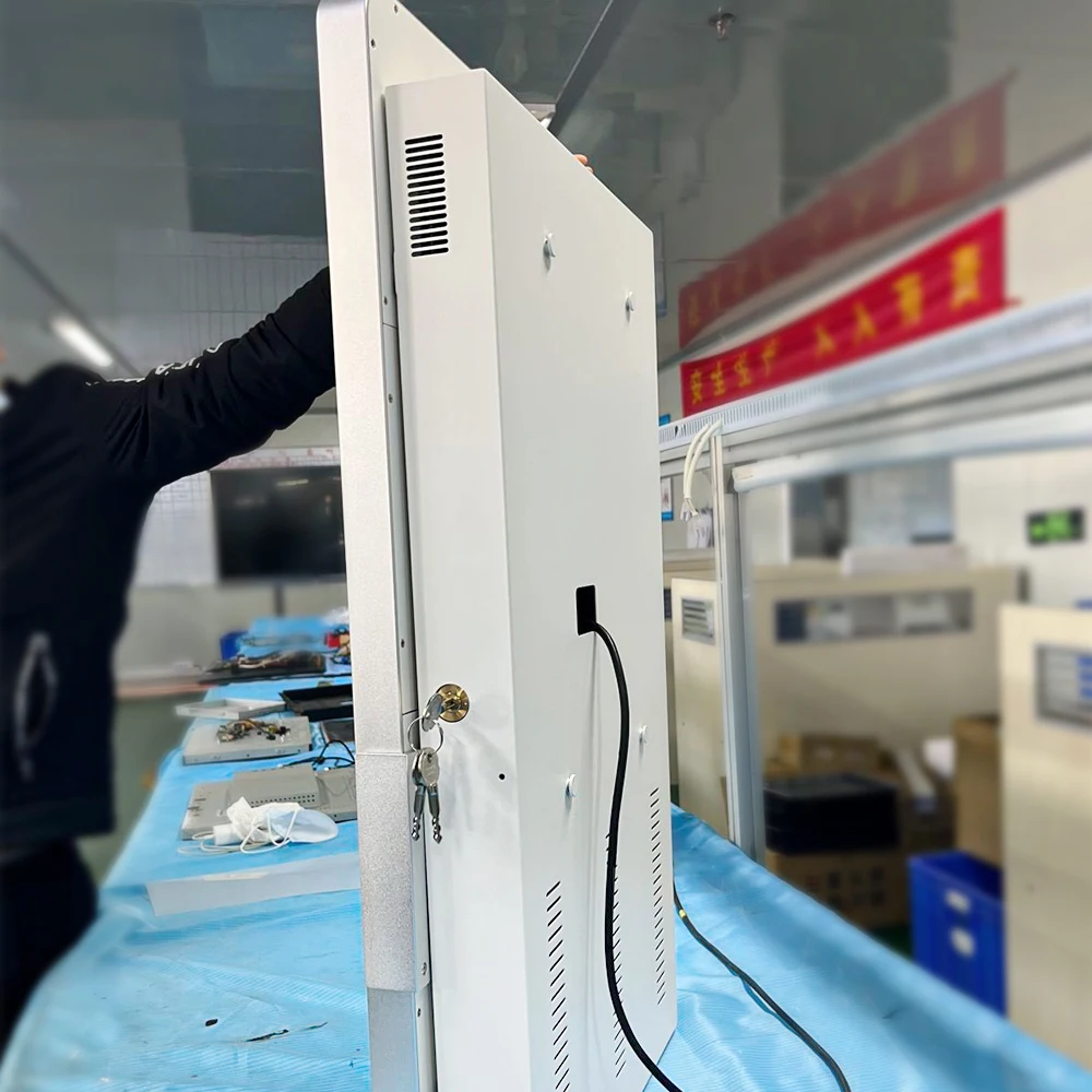 Wall-mounted self-service ticket collecting kiosk in cinema theater stadium