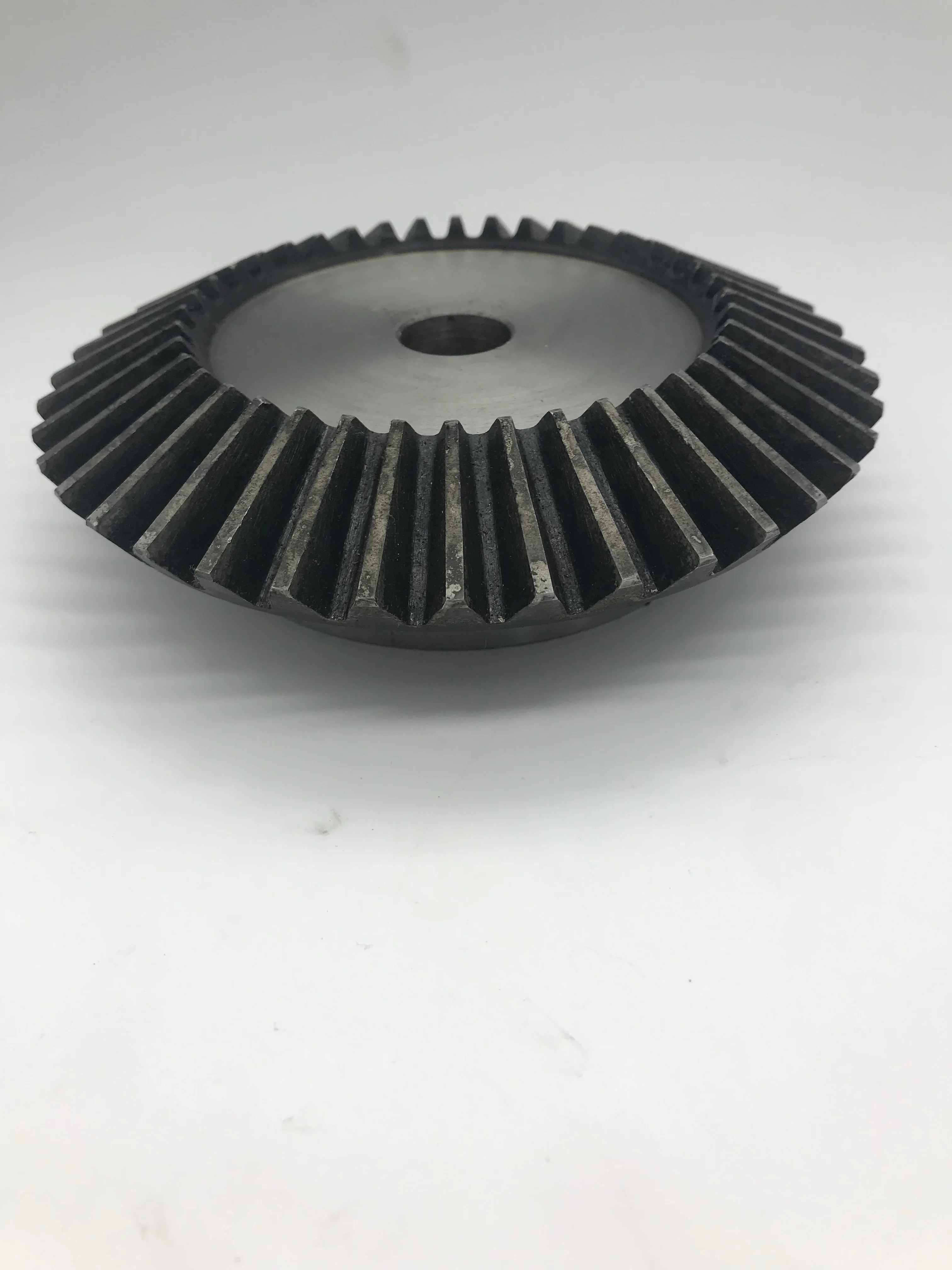 
High strength and low cost bevel spur gear, forging process hardened teeth for baler 