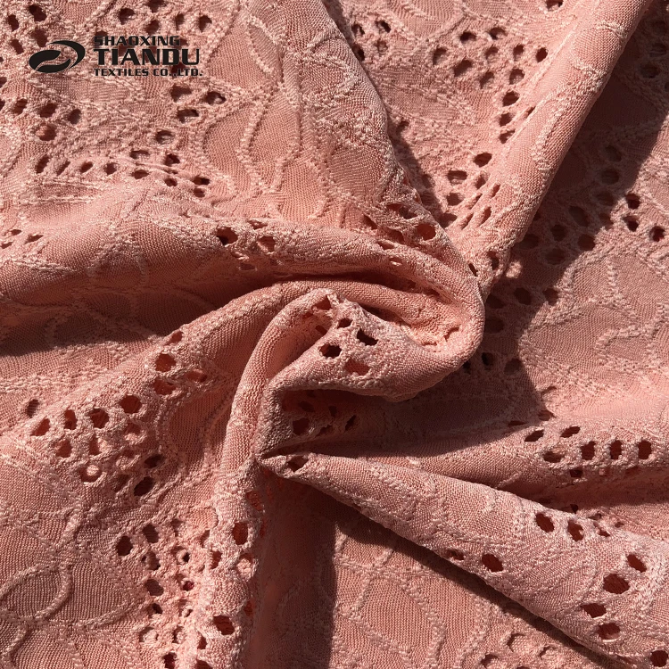 
Super soft Embroidered Solid DTY eyelet knitted jacquard 95% polyester 5% spandex stretch fabric 