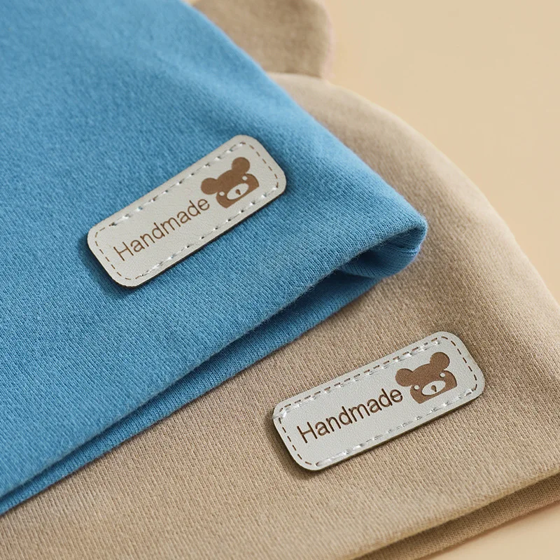 Wholesale solid color soft knitting cotton baby beanie fetal hat with bear ears for unisex newborn infant