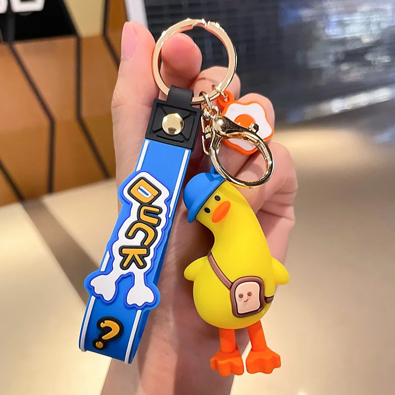 Funny tilt head duck cute anime pvc 3d keychain custom logo pvc rubber keychain Key Handbag Accessories