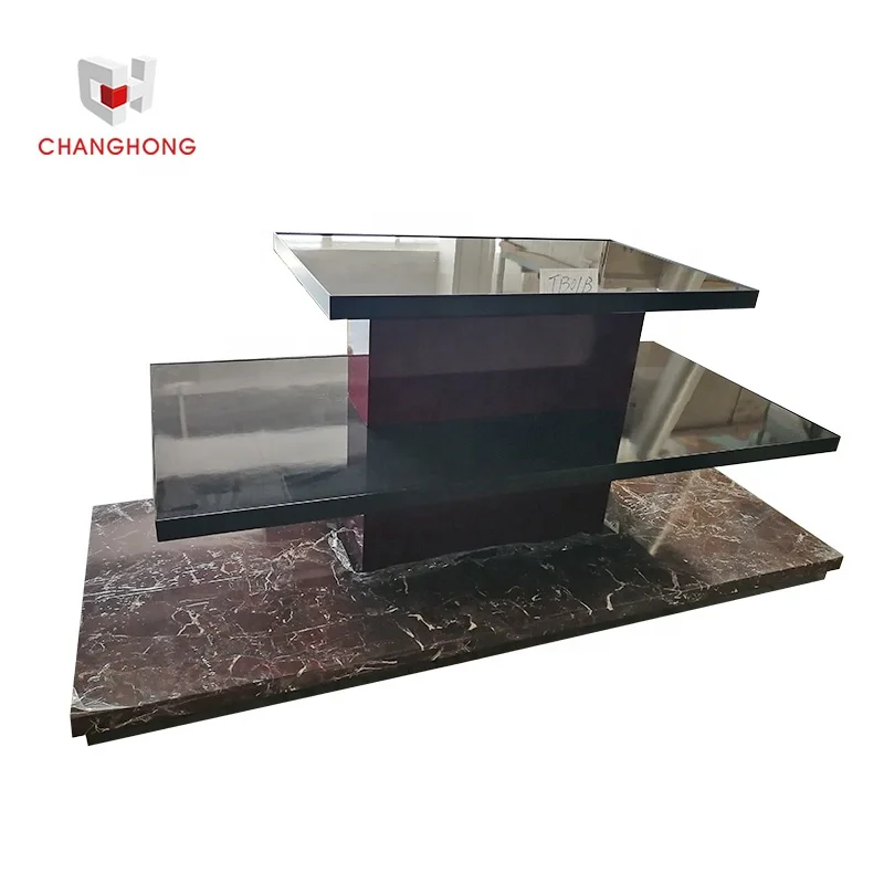 Multifunctional clothing display stand with black wooden countertop on three-layer red marble base for retail shop