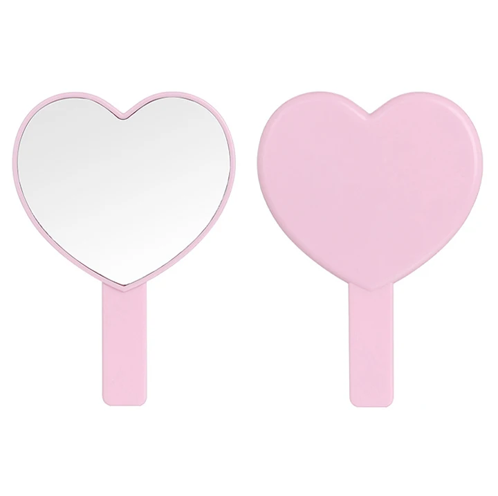 custom design women portable compact heart shape handheld glass mirror handle makeup mirror with pink frame for bedroom