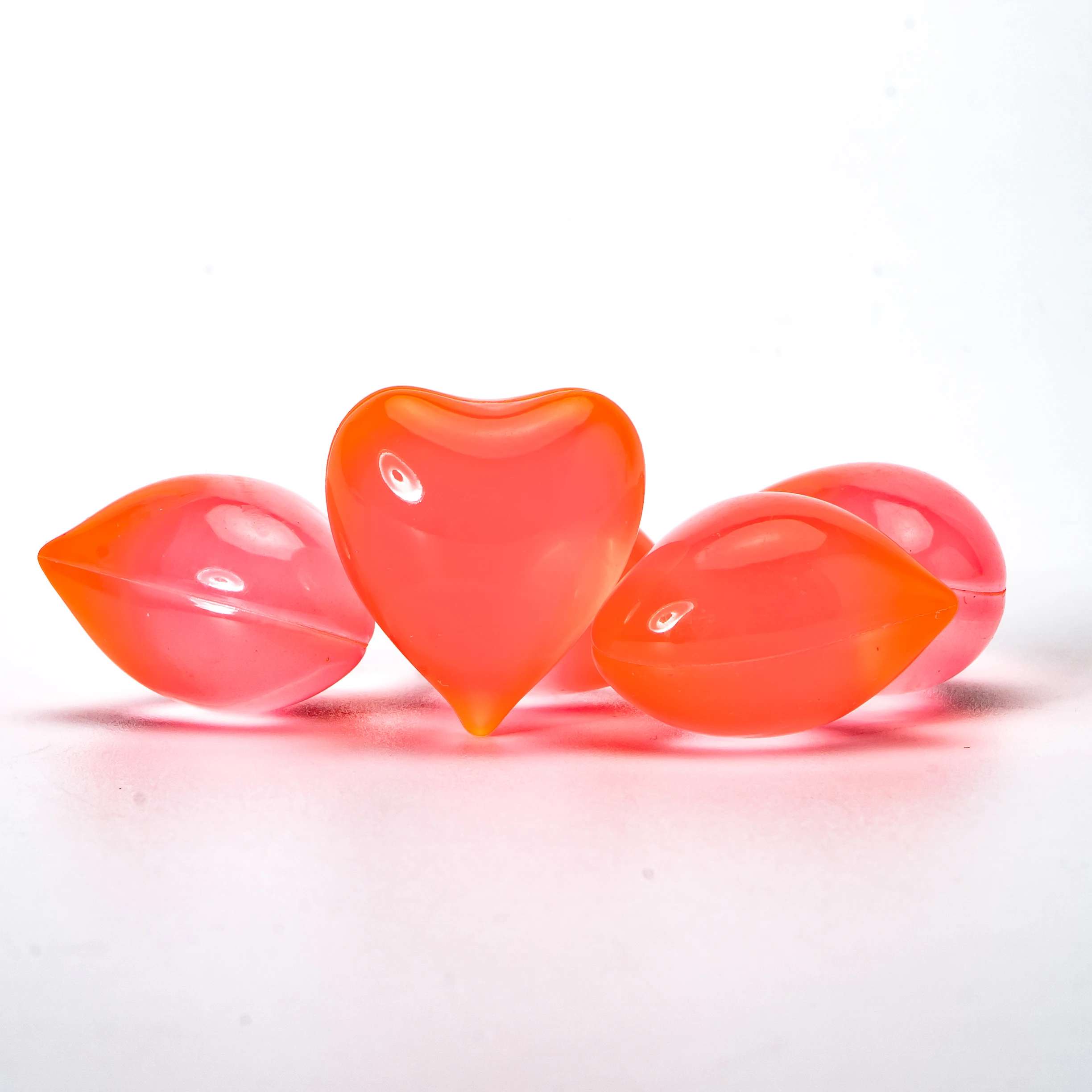 Different cosmetics facial pearl beauty oil capsule heart shaped bath oil beads