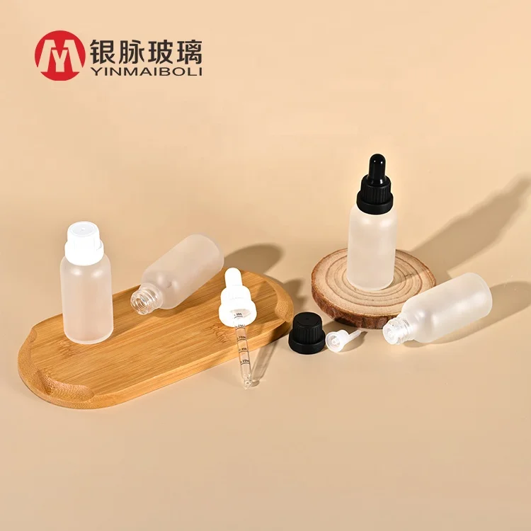 Wholesale 5ml 10ml 15ml 20ml 30ml 50ml 100ml clear frosted amber essential oil glass dropper bottle with paper tube