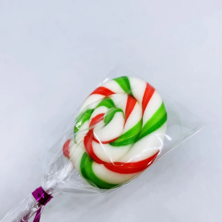 Конфеты, круглые красные и зеленые леденцы, желейные палочки, конфеты