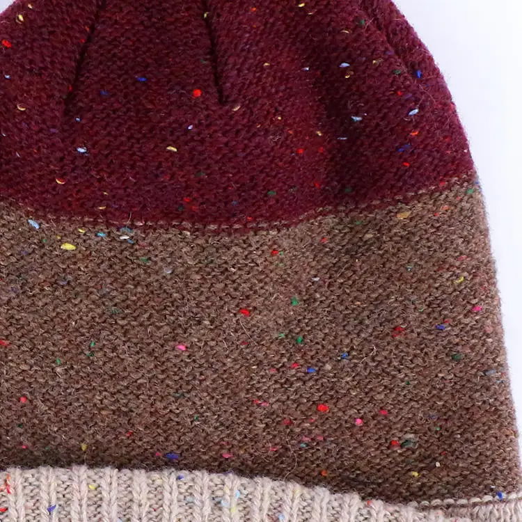 Qianzun manufacturer custom winter chunky speckle yarn block cuff pom pom beanie with leather patch