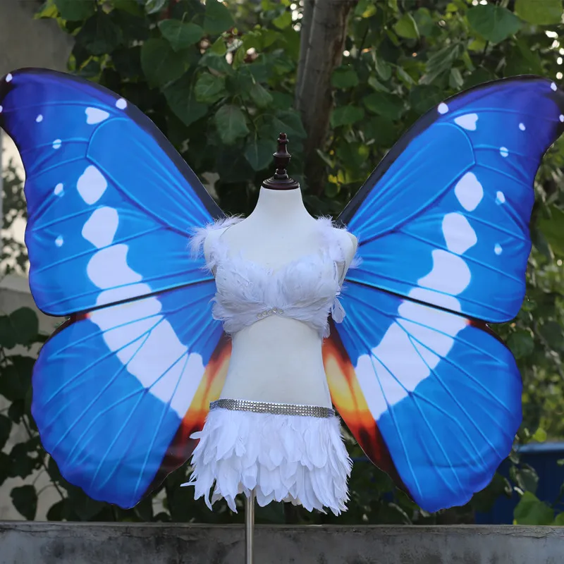 Adult models show large black wings fairy props to perform butterfly wings