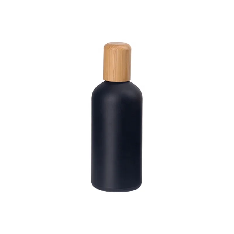 matte black glass bottles 100 ml glass essential oil bottles with 18 mm bamboo lid and drip plug for body massage oil