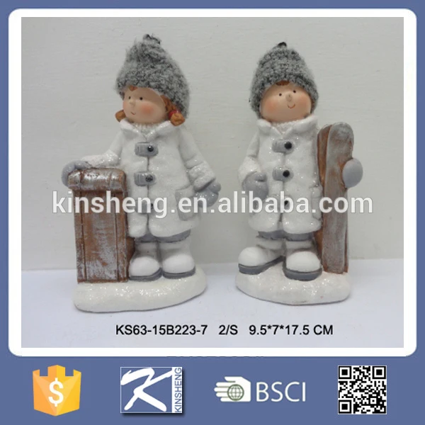 Christmas boy and girl ceramic figurines for sale