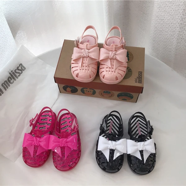 2023 mini Melissa shoes kid bowknot hollow out sandal jelly baby wrap toe soft sole beach wear resistant skid shoes