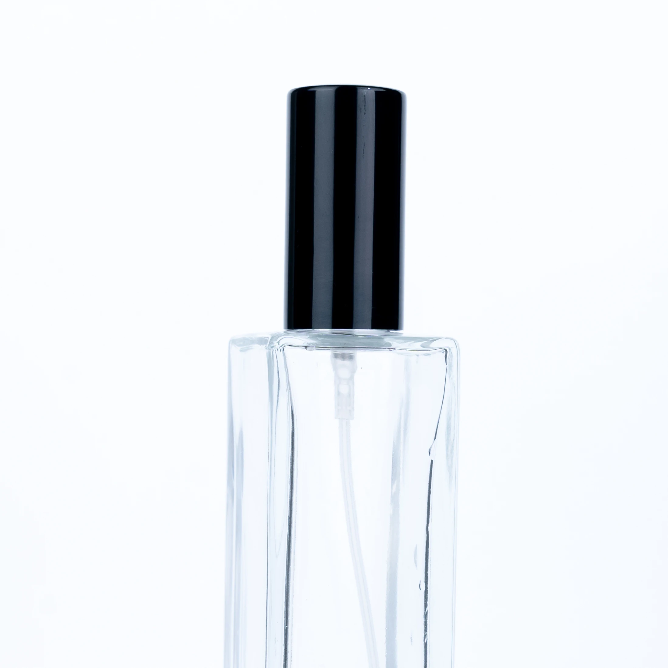 
The Customized High Quality 100ml Transparent Bottle With Black Round Cap Square Tall Perfume Bottle 