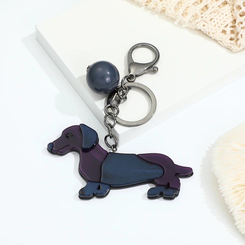 Wholesale customized animal cartoon cute dog key chain plastic pretty bag backpack acrylic keychain Manufacturers