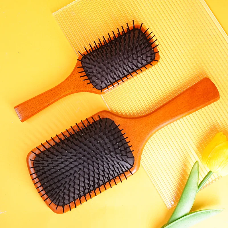 Hot selling fashionable anti-static wooden natural custom logo nylon pins air cushion paddle hair brush