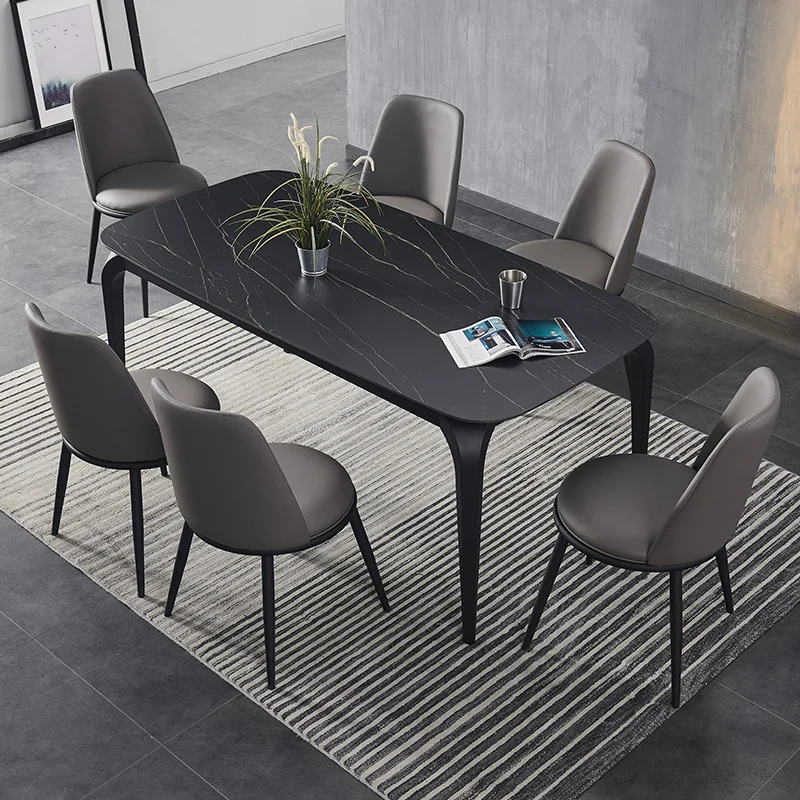 
A set of tables and chairs in the living room dining room 