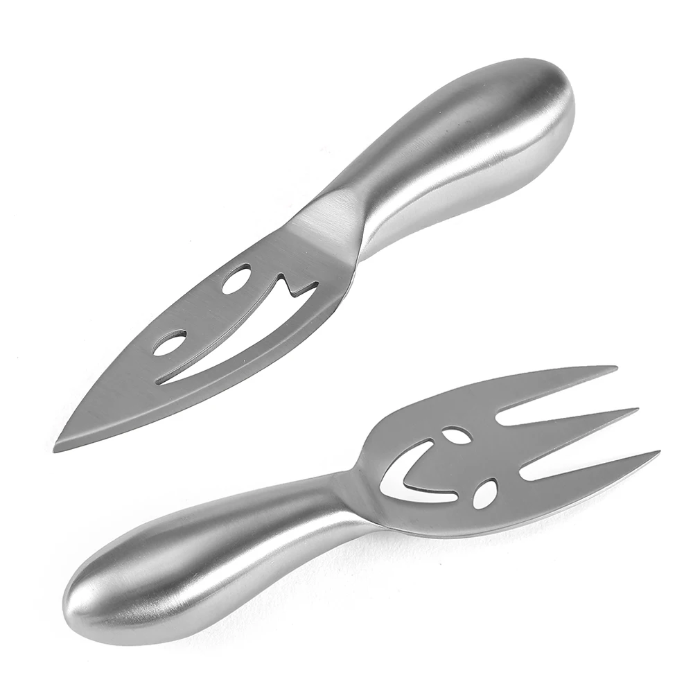 Our factory direct selling 4piece 2Cr14 stainless steel smiling face cream cheese knife hollow handle