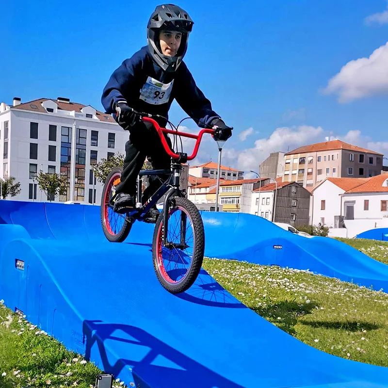Plastic modular pump track velocity loop 2 is a sequence of roll overs  and berms  for bikes, BMX scooters and skateboards