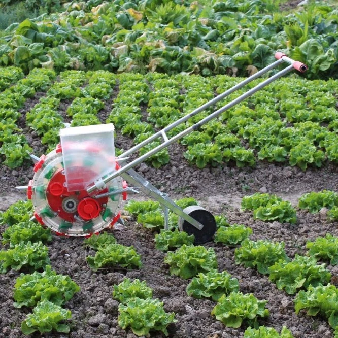 Hand-held small household planting corn, soybean and cotton seeder for farm planting