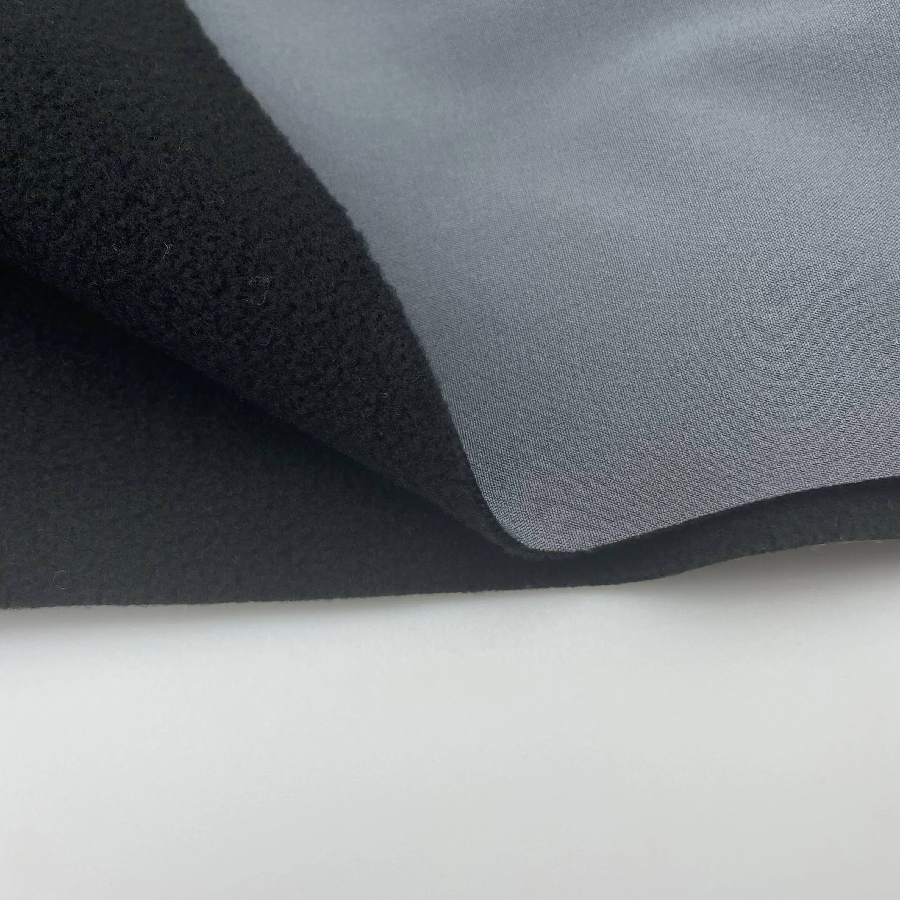 soft shell tricot fabric polar fleece bonded fabric three in one laminated coral fleece bonded sponge fabric OEM can customize
