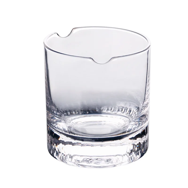 Cigar holding whiskey glass