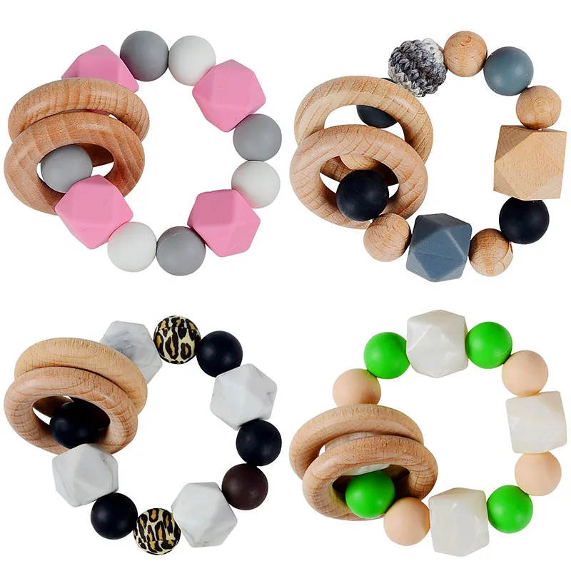 New Design Sensory Baby Teething Toys Rattle Soft Bpa Free Wood Baby Teether Ring Kids Food Grade Silicone Teether