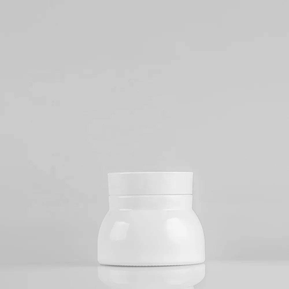 Blue glass bottle with pump and silver cap for lotion and serum