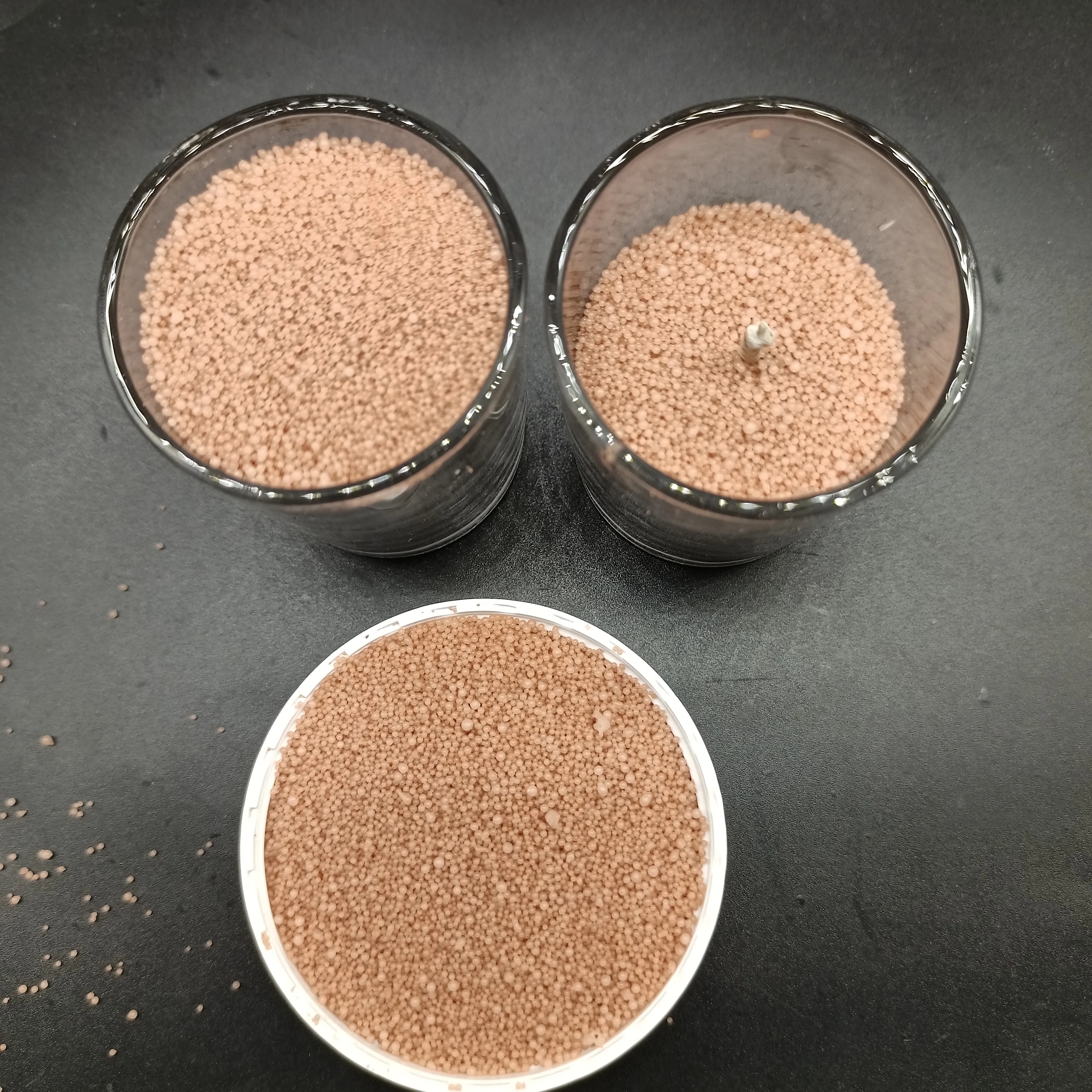 Plant based powder candle wax sand in colors orange pink desert rose