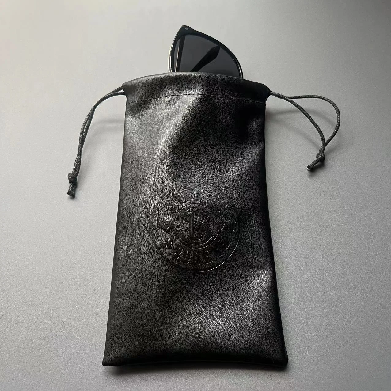 High Quality Black PU Leather Drawstring Sunglasses Eyeglasses Soft Bag with Custom Embossed Logo