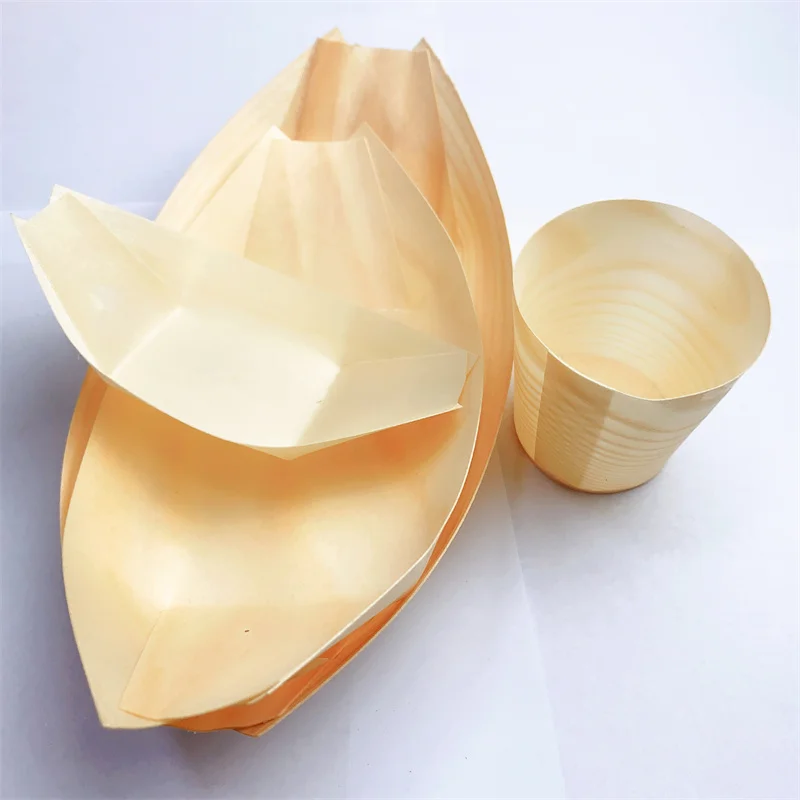 Eco-friendly wooden boat plates, biodegradable, suitable for holding various delicacies and displaying at parties.