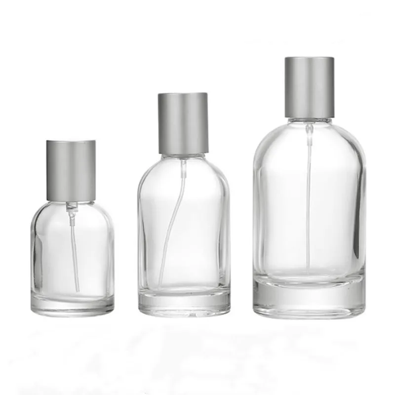 Wholesale 30 ml 50 ml 100 ml Round Cylinder Transparent Spray Glass Perfume Bottle with Lid