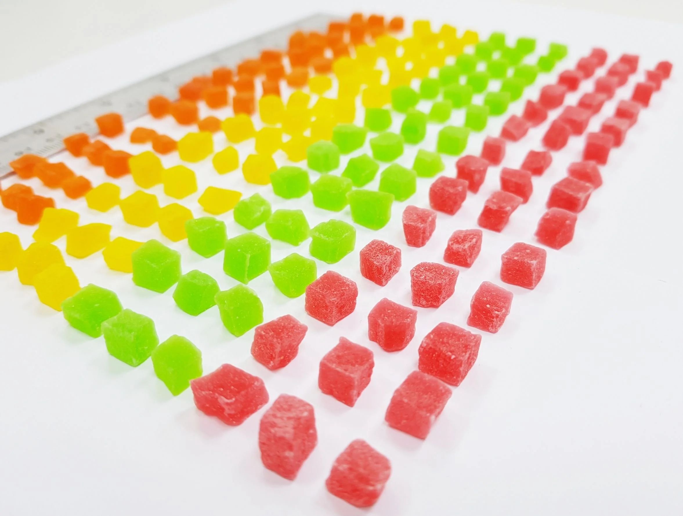 Dried candied Papaya dices 5-7 mm mixed colors added Thailand