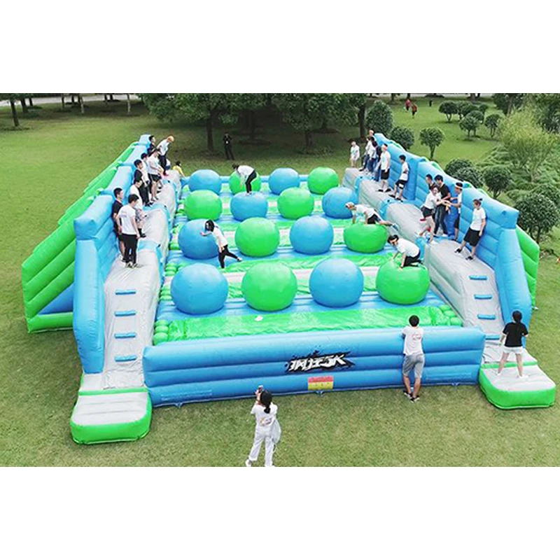 Large four lanes competitive outdoor big baller wipe out sport game inflatable wipe out for fun and carnival